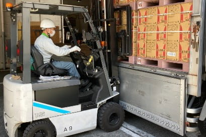Image of loading a truck with a forklift